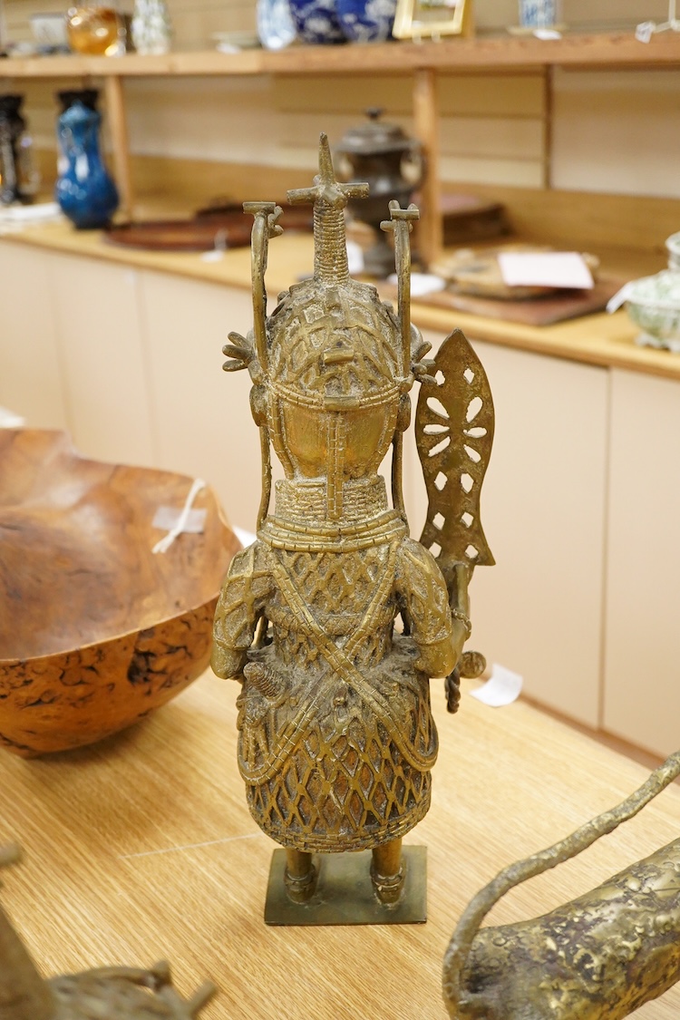 Three Benin type bronzes to include a bust, largest 47cm high